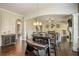 Open dining area with a dark wood table and bench seating at 5269 Heron Bay Blvd, Locust Grove, GA 30248