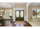 Elegant entryway with double doors and hardwood floors at 5269 Heron Bay Blvd, Locust Grove, GA 30248