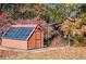 Outdoor solar-powered shed with adjacent wooded area at 4771 Cool Springs Rd, Winston, GA 30187