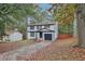 Two-story house with white siding, black accents, and a driveway at 2080 Singer Way, Lithonia, GA 30058