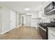 Kitchen with white cabinets, granite countertops, and stainless steel appliances at 2080 Singer Way, Lithonia, GA 30058