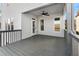 Large, gray back deck, partially covered with ceiling fan at 303 Cornerstone Trce, Woodstock, GA 30188