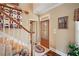 Inviting entryway with hardwood floors, staircase, and glass door at 291 Miquel Jorge Ln, Canton, GA 30115