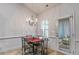 Bright dining area with chandelier and access to backyard at 515 Ankara Ct, Fairburn, GA 30213