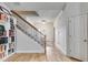 Elegant staircase with wrought-iron railing and bookcase at 515 Ankara Ct, Fairburn, GA 30213