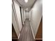 Long hallway with doors leading to various basement rooms at 6700 Roswell Rd # 13B, Atlanta, GA 30328