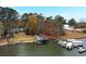 Aerial view showcasing lakefront property with docks and boats at 2440 Emerald Dr, Jonesboro, GA 30236