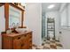 Clean bathroom with checkered floor and updated vanity at 2440 Emerald Dr, Jonesboro, GA 30236
