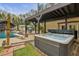 Private hot tub nestled near the pool and outdoor shower at 2440 Emerald Dr, Jonesboro, GA 30236