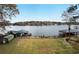 Expansive lakefront backyard with boathouses and a large grassy area at 2440 Emerald Dr, Jonesboro, GA 30236