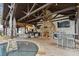 Outdoor kitchen with fireplace, bar seating, and TV at 2440 Emerald Dr, Jonesboro, GA 30236