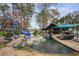 Stunning pool with a waterslide, spa, and expansive patio at 2440 Emerald Dr, Jonesboro, GA 30236