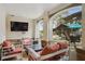 Relaxing screened porch with comfortable seating and a view of the backyard at 2440 Emerald Dr, Jonesboro, GA 30236