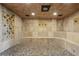 Basement shower with tiled walls and pebble floor at 2440 Emerald Dr, Jonesboro, GA 30236