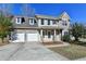 Two-story house with stone accents, three-car garage, and landscaped yard at 3263 Star Pine Ct, Duluth, GA 30096