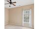 Bright bedroom featuring a window with curtains and ceiling fan at 727 Pear Grove Pl, Marietta, GA 30066