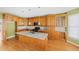 Updated kitchen with granite island and stainless steel appliances at 727 Pear Grove Pl, Marietta, GA 30066