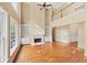 Two-story living room with hardwood floors and fireplace at 727 Pear Grove Pl, Marietta, GA 30066
