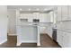 Modern kitchen with island, white cabinets, and stainless steel appliances at 2280 Highridge Point Dr, Lithia Springs, GA 30122