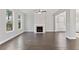 Open living room with hardwood floors and fireplace at 2280 Highridge Point Dr, Lithia Springs, GA 30122