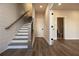 Basement hallway with staircase, wood-look floors and bathroom at 260 Briscoe Way # 36, Alpharetta, GA 30009