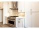 Modern kitchen featuring stainless steel range and white shaker cabinets at 260 Briscoe Way # 36, Alpharetta, GA 30009