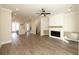 Open concept living room with hardwood floors and fireplace at 260 Briscoe Way # 36, Alpharetta, GA 30009