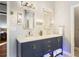 Elegant bathroom with double vanity, large mirrors, and modern fixtures at 451 Shyrewood Dr, Lawrenceville, GA 30043