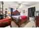 Large main bedroom with a king-size bed and a dresser at 8174 Attleboro Dr, Jonesboro, GA 30238