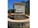 Knollwood community entrance sign, featuring a brick and stone structure at 11355 Bennett Ln, Johns Creek, GA 30097