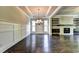 Elegant dining room features hardwood floors, wainscoting, and a beautiful chandelier at 11355 Bennett Ln, Johns Creek, GA 30097