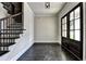 Bright entryway with dark hardwood floors and elegant staircase at 11355 Bennett Ln, Johns Creek, GA 30097