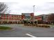 Hospital building with brick facade and ample parking at 11355 Bennett Ln, Johns Creek, GA 30097