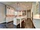 Gourmet kitchen with large island and stunning marble countertops at 11355 Bennett Ln, Johns Creek, GA 30097