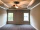 Spacious main bedroom with ceiling fan and neutral color palette at 11355 Bennett Ln, Johns Creek, GA 30097