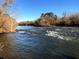 View of a wide river with trees and a clear sky at 11355 Bennett Ln, Johns Creek, GA 30097