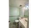 Clean bathroom with light-green walls and tiled floor at 764 Inland Nw Way, Lilburn, GA 30047