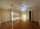 Spacious bedroom with hardwood floors and a ceiling fan at 764 Inland Nw Way, Lilburn, GA 30047