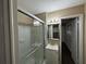 Clean bathroom with a sliding glass shower, vanity, and mirror at 2820 Arlington Rd, Atlanta, GA 30344