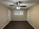 Spacious bedroom with ceiling fan, dark wood floors and double closets at 2820 Arlington Rd, Atlanta, GA 30344