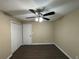 Bright bedroom featuring ceiling fan, wood-look floors, and double door closet at 2820 Arlington Rd, Atlanta, GA 30344