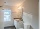 Clean bathroom with a window, vanity and toilet at 6390 Alford Cir, Lithonia, GA 30058