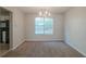 Dining area with chandelier and neutral carpet at 6390 Alford Cir, Lithonia, GA 30058