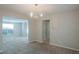 Dining room with chandelier and view to living room at 6390 Alford Cir, Lithonia, GA 30058
