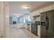 Kitchen with white cabinets and black appliances at 6390 Alford Cir, Lithonia, GA 30058