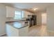 Kitchen with white cabinets, black appliances, and dark counters at 6390 Alford Cir, Lithonia, GA 30058