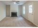 Living room with fireplace and neutral carpeting at 6390 Alford Cir, Lithonia, GA 30058