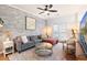 Spacious living room featuring a sectional sofa, a coffee table, and hardwood floors at 1397 Liberty Parkway Nw, Atlanta, GA 30318