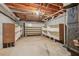 Unfinished basement with built-in shelving for extra storage at 5235 Shadow Path Sw Ln, Lilburn, GA 30047