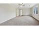 Large bedroom with neutral walls and carpet at 5235 Shadow Path Sw Ln, Lilburn, GA 30047